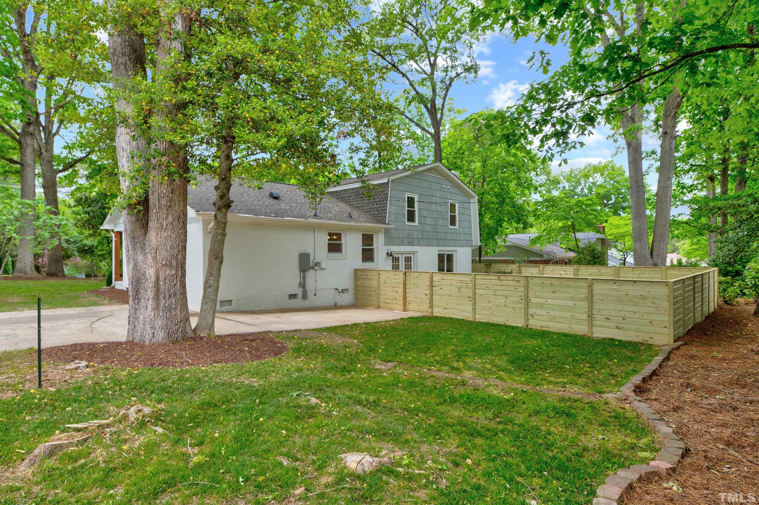 5400 Farley Drive Raleigh, NC 27609 - Photo 31 of 31 a view of a house with a yard and large trees