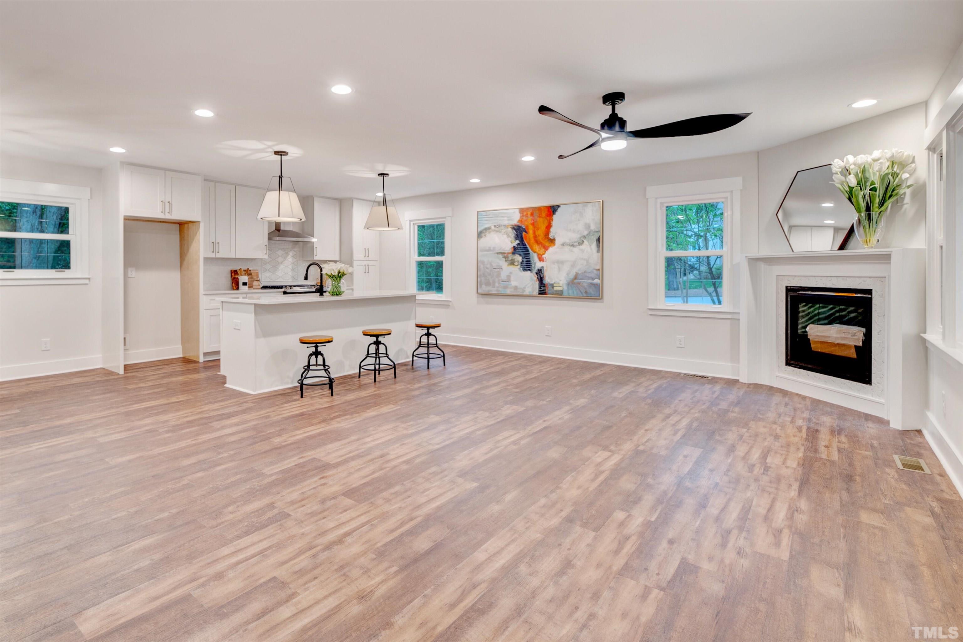 5400 Farley Drive Raleigh, NC 27609 - Photo 4 of 31 a living room with furniture and a fireplace