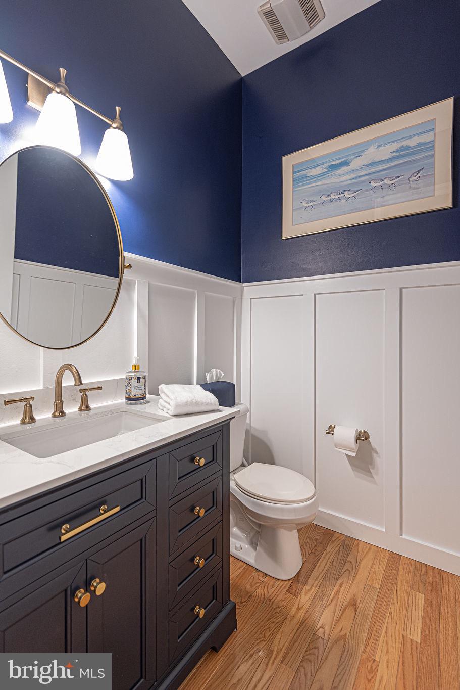 89 October Glory Avenue Ocean View, DE 19970 - Photo 14 of 77 a bathroom with a granite countertop sink a toilet and a mirror