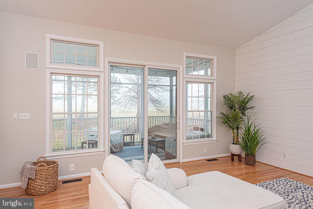 89 October Glory Avenue Ocean View, DE 19970 - Photo 28 of 77 a living room with furniture and a large window