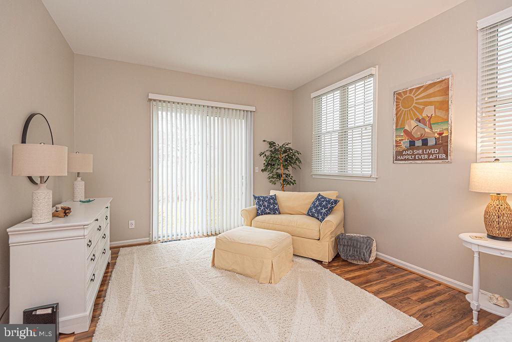89 October Glory Avenue Ocean View, DE 19970 - Photo 38 of 77 a bedroom with furniture and a window