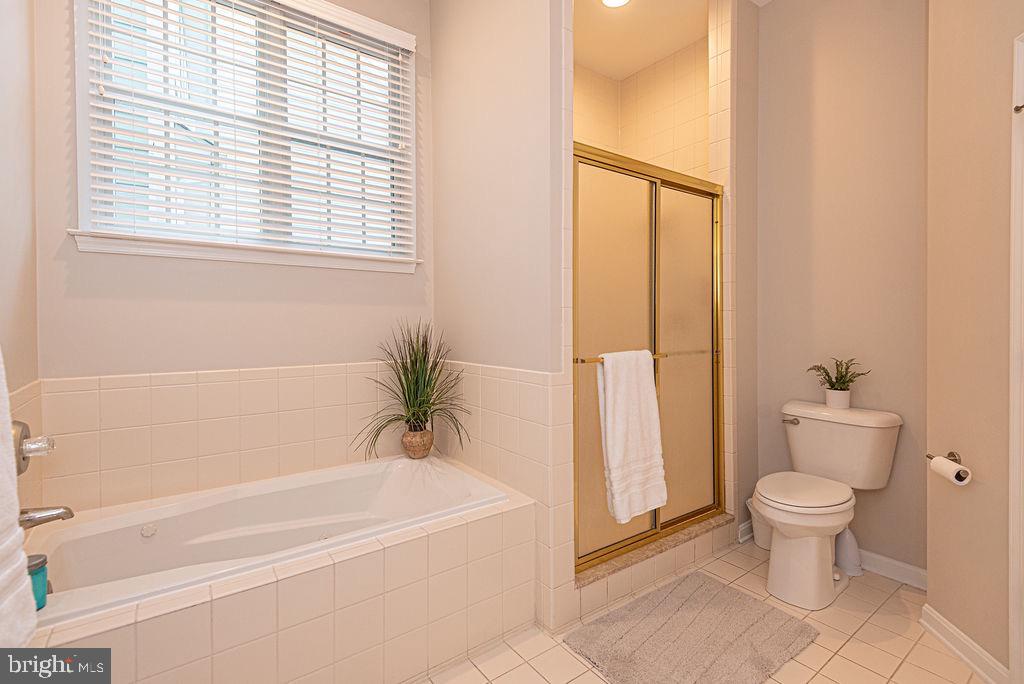 89 October Glory Avenue Ocean View, DE 19970 - Photo 42 of 77 a bathroom with a toilet and a bathtub