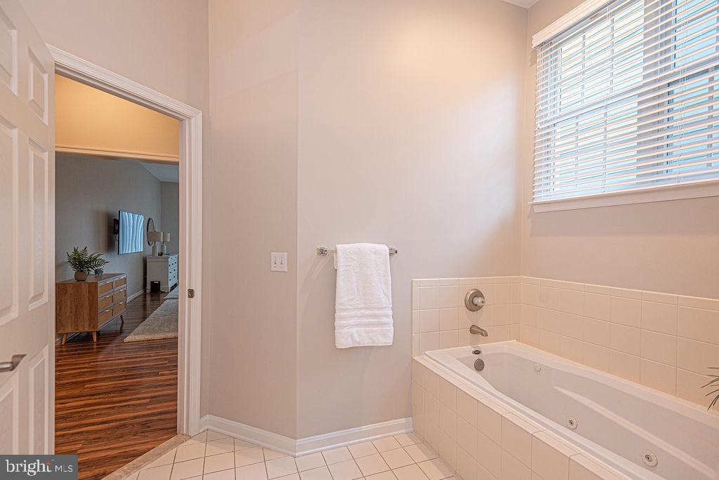 89 October Glory Avenue Ocean View, DE 19970 - Photo 46 of 77 a bathroom with a tub shower and sink