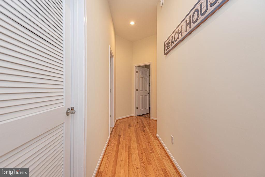 89 October Glory Avenue Ocean View, DE 19970 - Photo 47 of 77 a view of a hallway with wooden floor and staircase