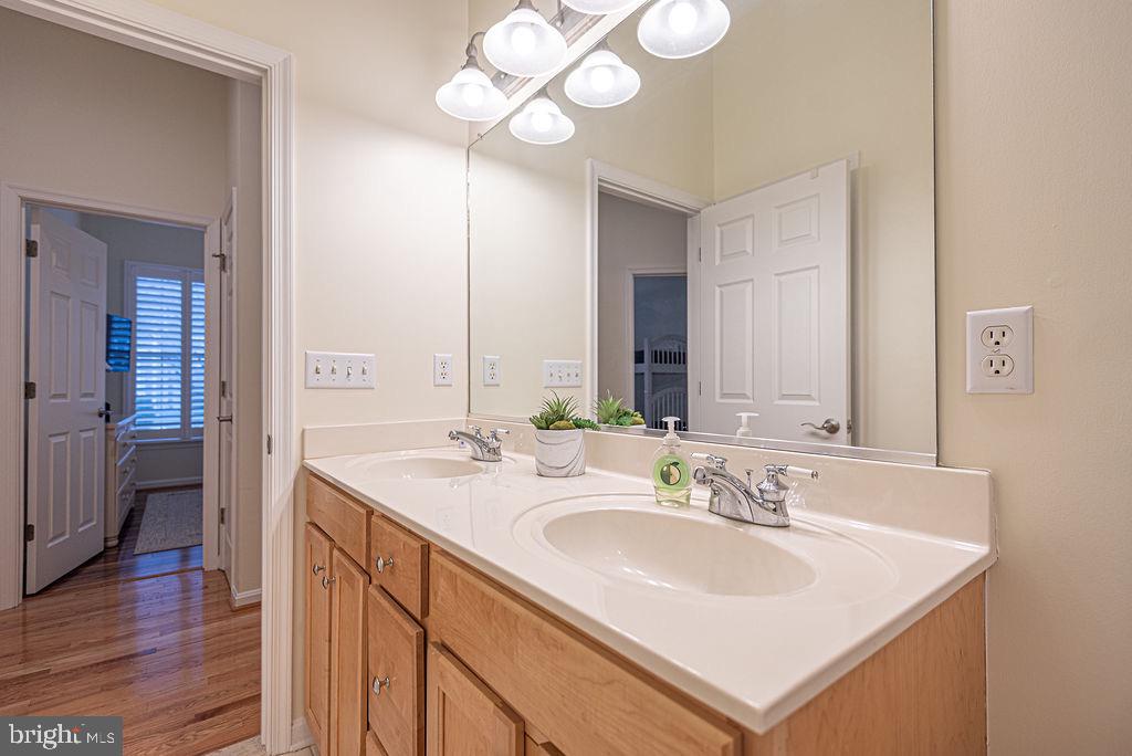 89 October Glory Avenue Ocean View, DE 19970 - Photo 51 of 77 a bathroom with a sink a light fixture and a mirror