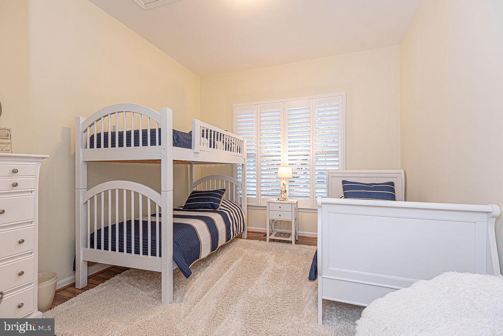 89 October Glory Avenue Ocean View, DE 19970 - Photo 56 of 77 a bedroom with a bed and a window