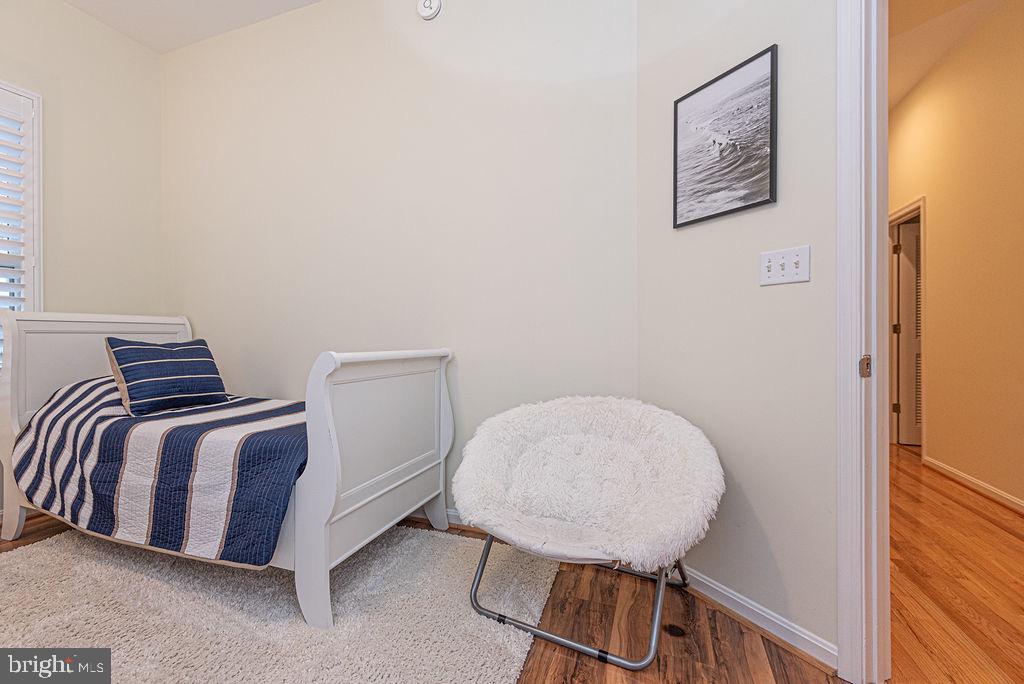 89 October Glory Avenue Ocean View, DE 19970 - Photo 59 of 77 a spacious bedroom with a bed and a window