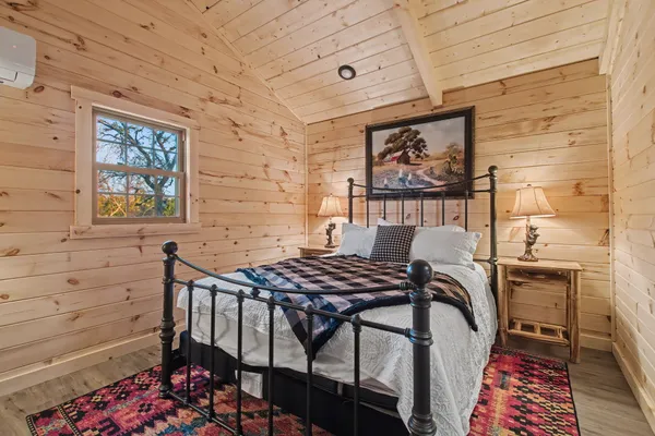 a bedroom with a bed and a dresser