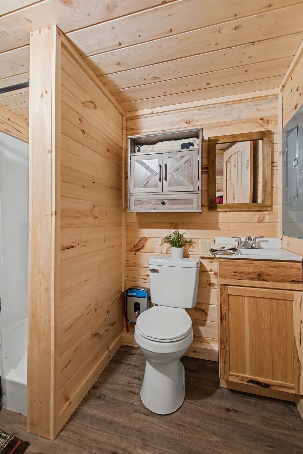 13510 County Road 3642 Kempner, TX 76539 - Photo 18 of 38 Bathroom featuring vanity, wooden walls, dark wood-type flooring, and wood ceiling