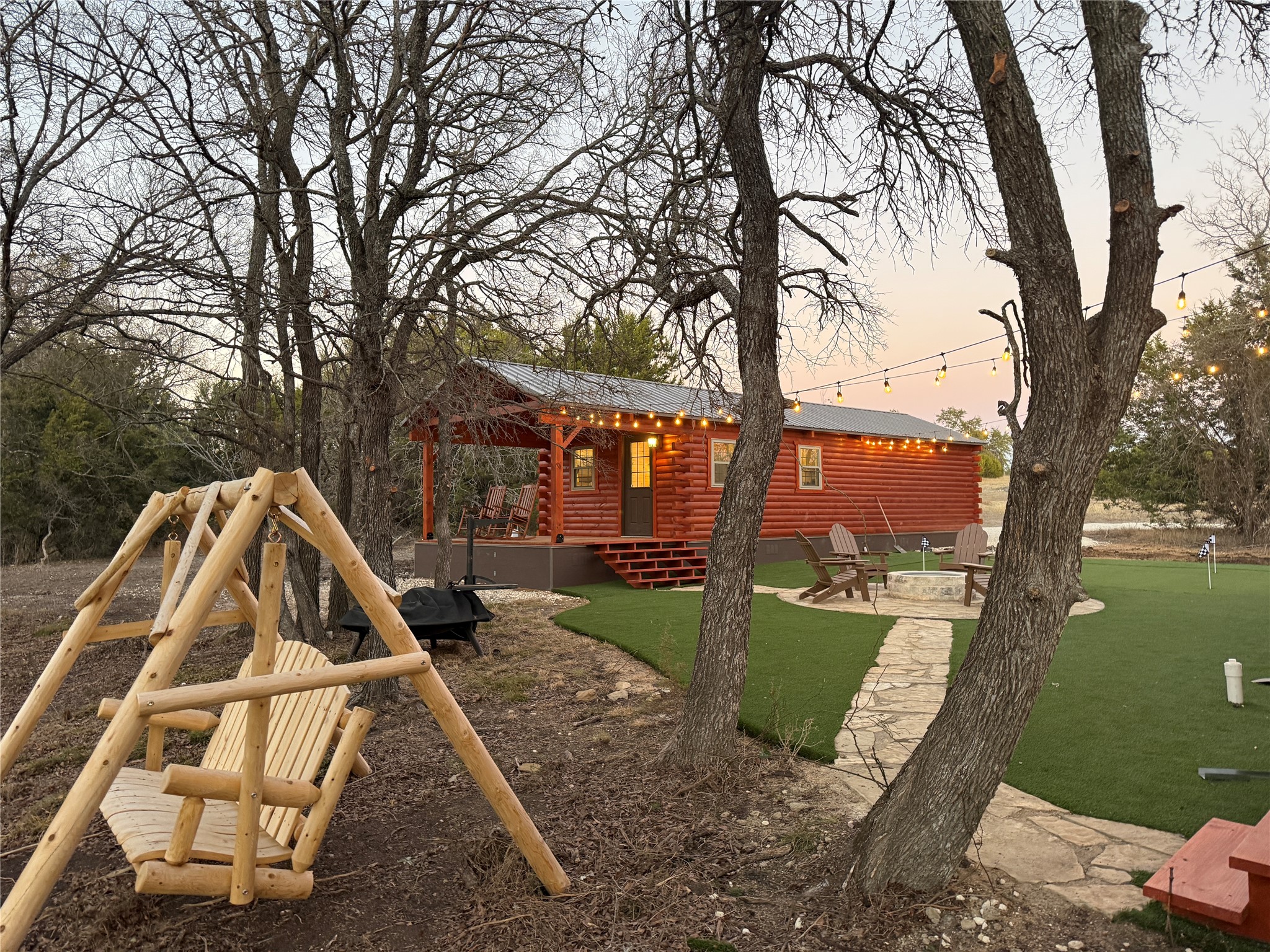13510 County Road 3642 Kempner, TX 76539 - Photo 2 of 38 View outdoor fire pit, a patio area, a wooden deck, and a putting area