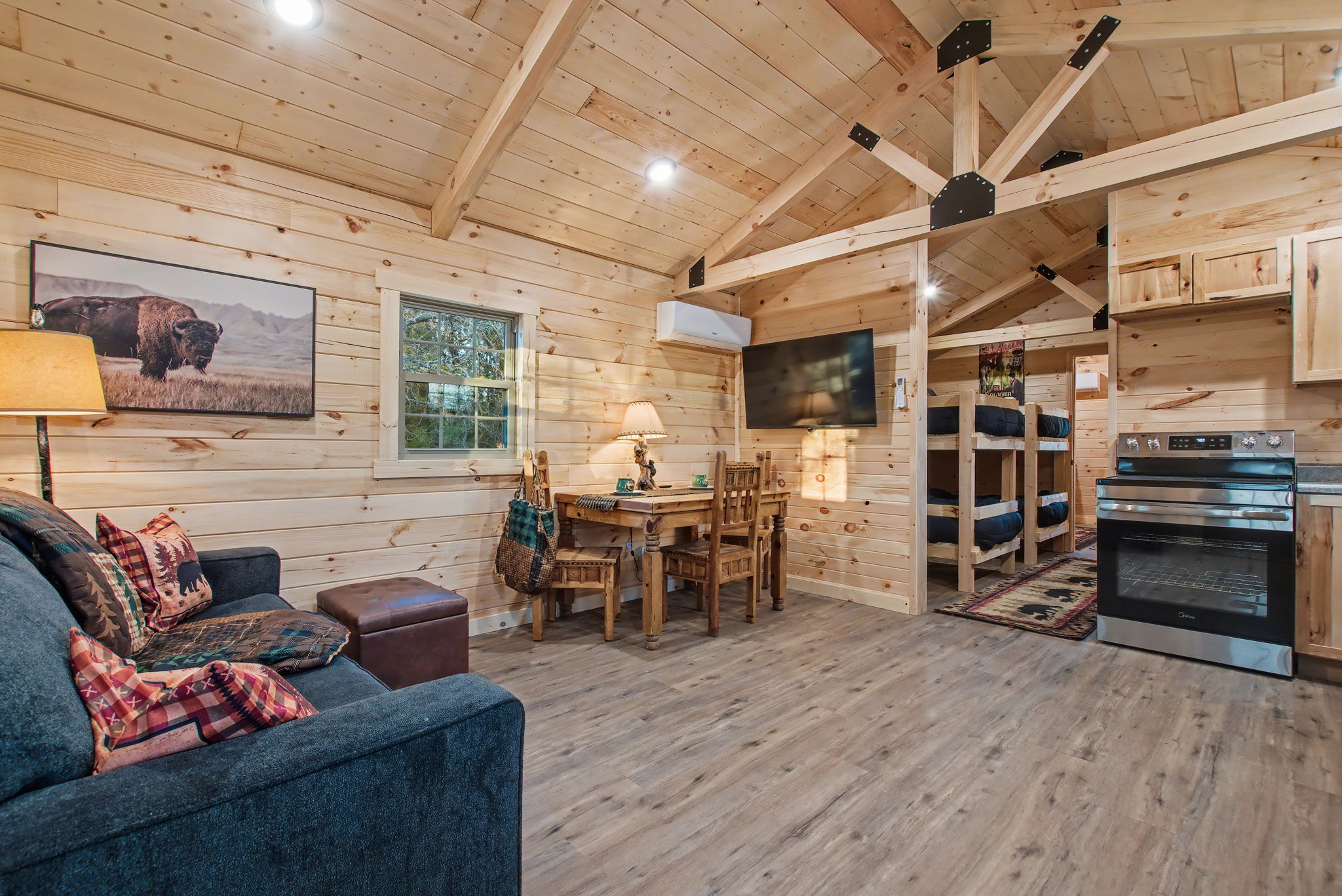 13510 County Road 3642 Kempner, TX 76539 - Photo 24 of 38 Living room featuring a wooden ceiling with exposed beams, light wood-type flooring, wood walls, and high vaulted ceiling