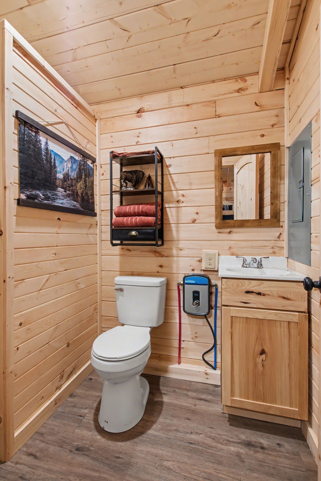 13510 County Road 3642 Kempner, TX 76539 - Photo 31 of 38 Half bathroom featuring wood walls, vanity, wood ceiling, and light wood-style floors