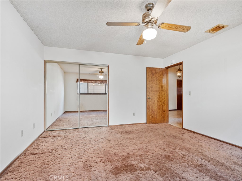 14484 Lighthouse Lane Helendale, CA 92342 - Photo 13 of 58 Guest bedroom with mirrored closet doors