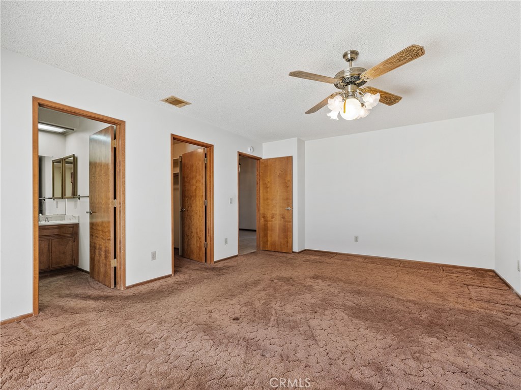 14484 Lighthouse Lane Helendale, CA 92342 - Photo 16 of 58 Primary Bedroom with ceiling fan