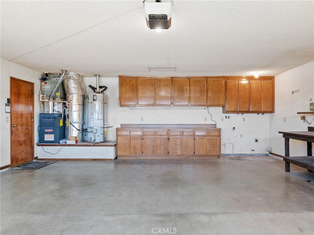 14484 Lighthouse Lane Helendale, CA 92342 - Photo 31 of 58 2-car attached garage with laundry hookups and built-in cabinets