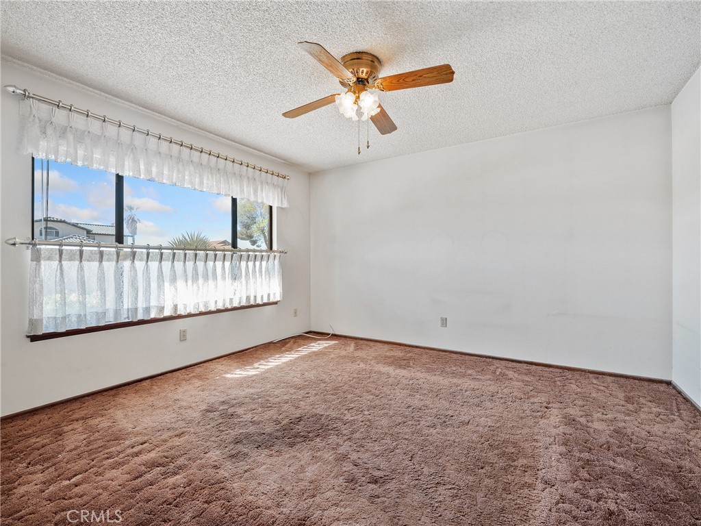 14484 Lighthouse Lane Helendale, CA 92342 - Photo 8 of 58 Guest bedroom with large window facing front of home