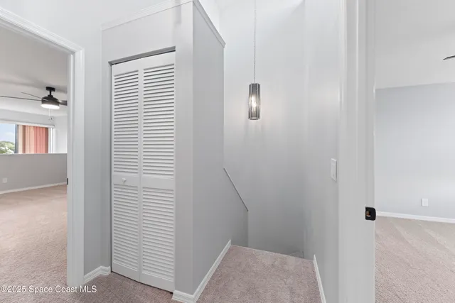 a view of hallway with windows