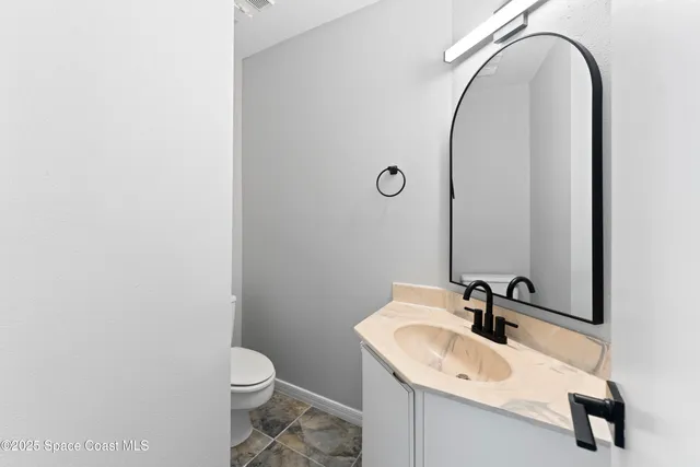 a bathroom with a sink and a toilet
