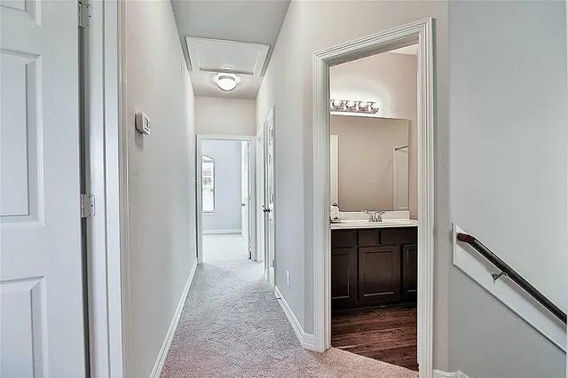 a view of a bathroom from the hallway