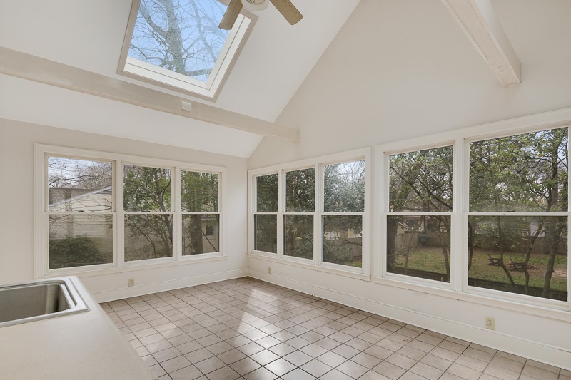 122 North Mendenhall Road Memphis, TN 38117 - Photo 13 of 24 Sunroom has 3 walls of windows, wet bar, vaulted ceilings, skylight, and access to the back yard.