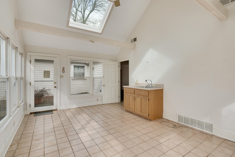 122 North Mendenhall Road Memphis, TN 38117 - Photo 14 of 24 Sunroom has 3 walls of windows, wet bar, vaulted ceilings, skylight, and access to the back yard.