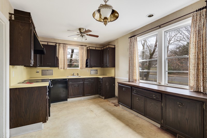 Kitchen is off the dining room and office, and has a side entrance to the driveway.