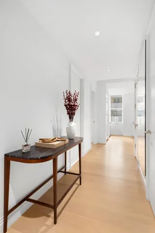 a view of a room with a table and a chair