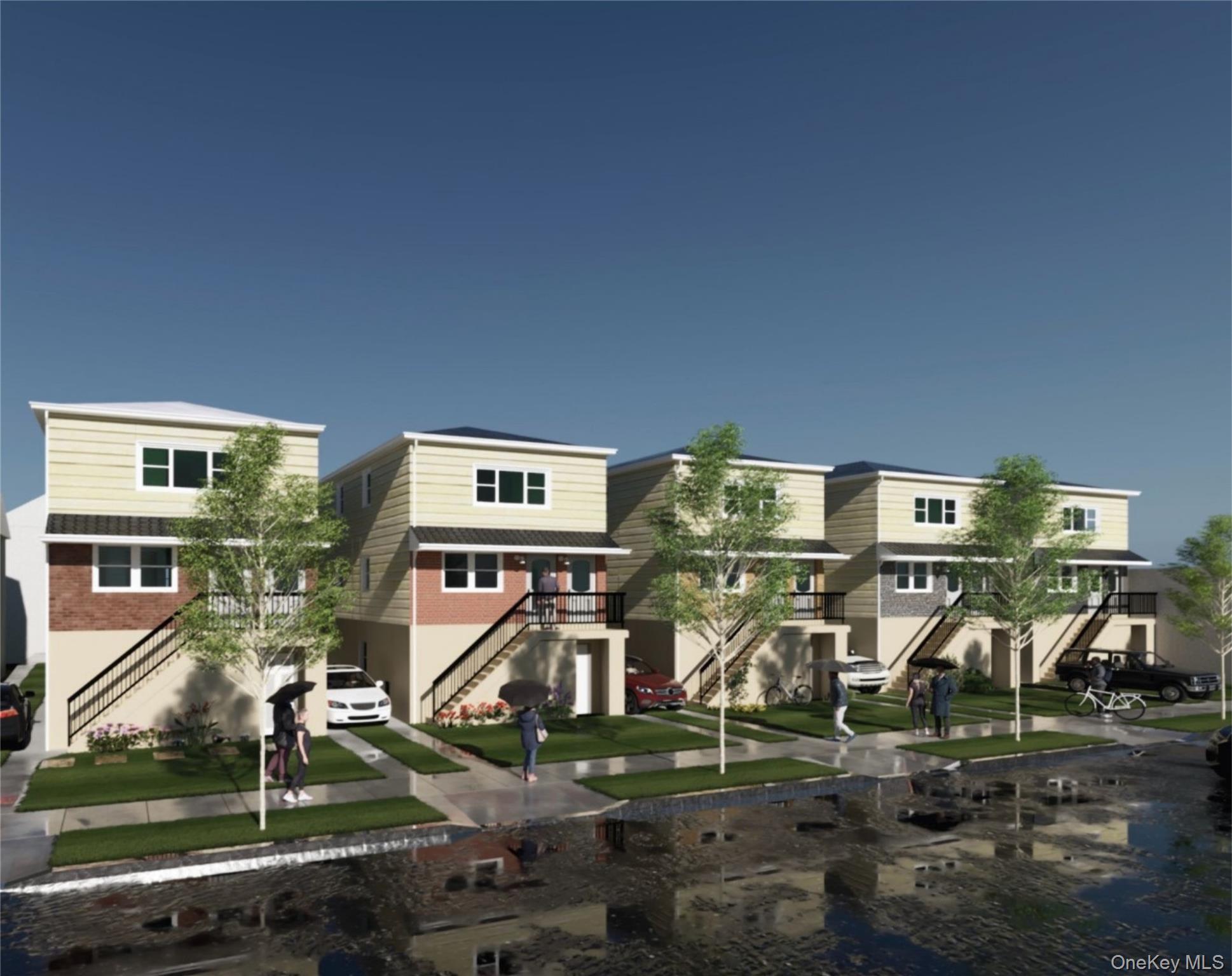 a front view of residential houses with cars parked