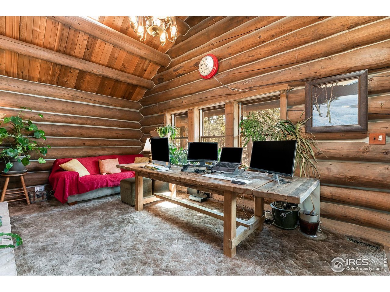 212 Valley Road Lyons, CO 80540 - Photo 12 of 38 a living room with a couch and a table