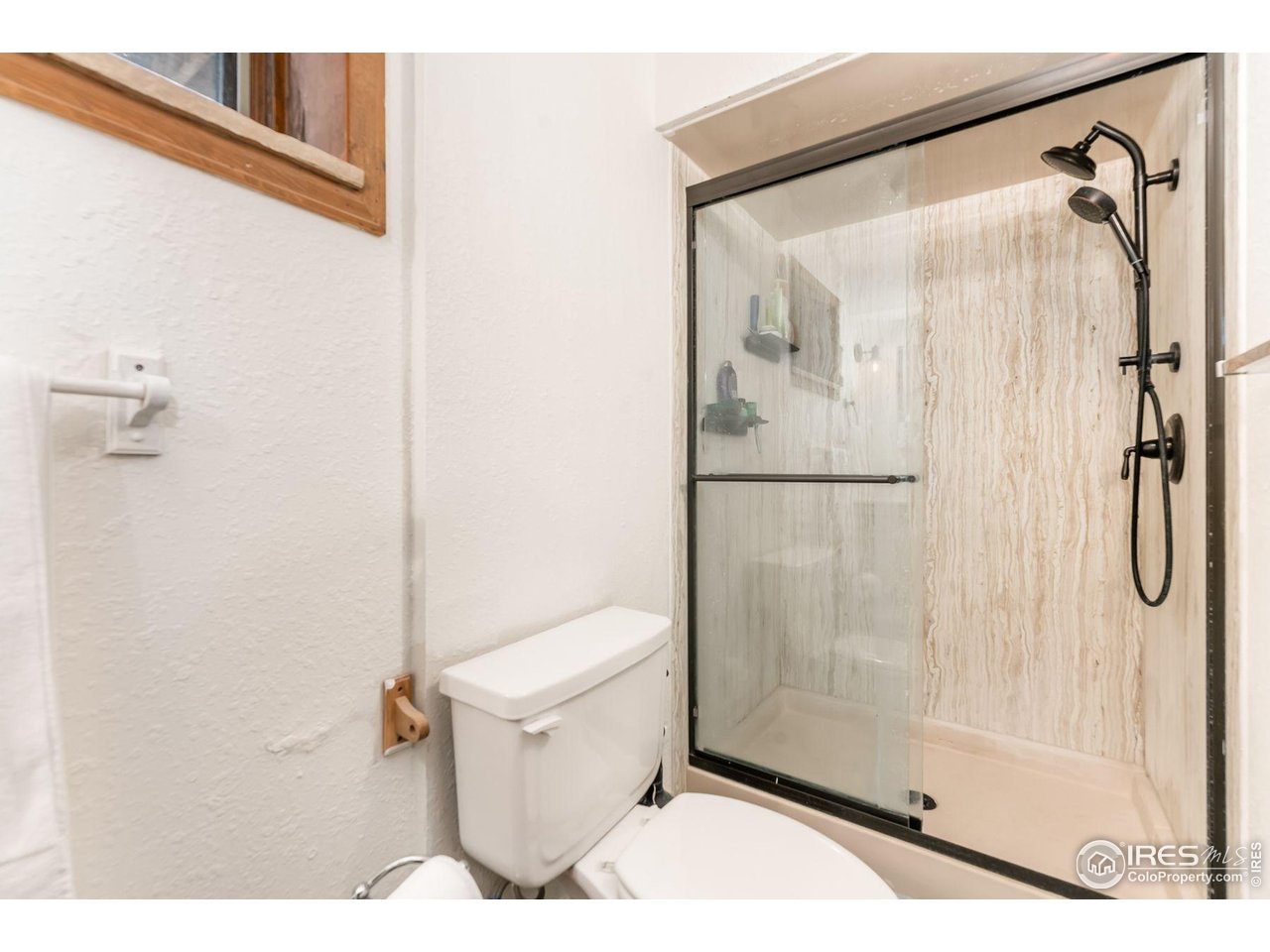 212 Valley Road Lyons, CO 80540 - Photo 21 of 38 a bathroom with a shower and a toilet