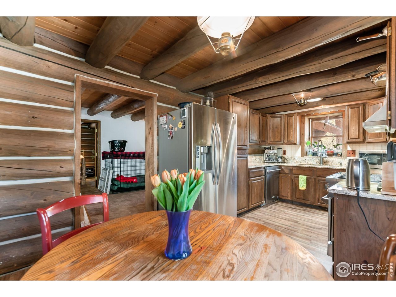 212 Valley Road Lyons, CO 80540 - Photo 4 of 38 a kitchen with refrigerator and cabinets