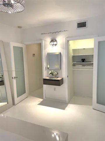 a bedroom with a bed and a table