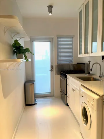 a view of a utility room with washer and dryer