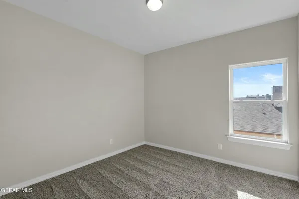 a view of an empty room and window