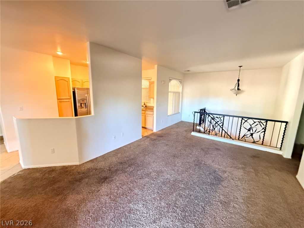 2050 West Warm Springs Road, Unit 3521 Henderson, NV 89014 - Photo 12 of 12 An open floorplan offers seamless flow between living spaces with views into the kitchen.