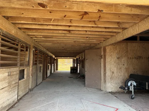 a view of a big room with wooden walls