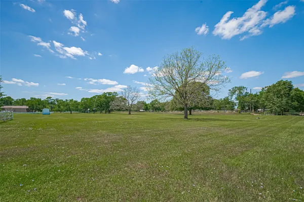 a view of a golf course with a lake