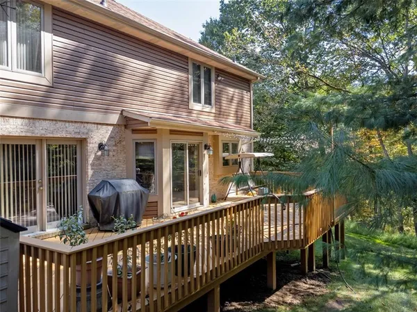 a house view with a garden and deck