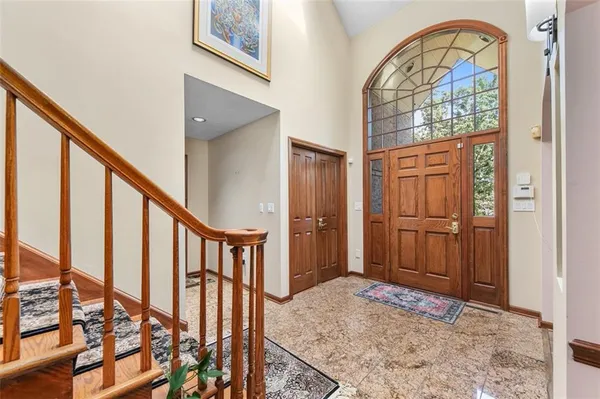 a view of an entryway with wooden floor