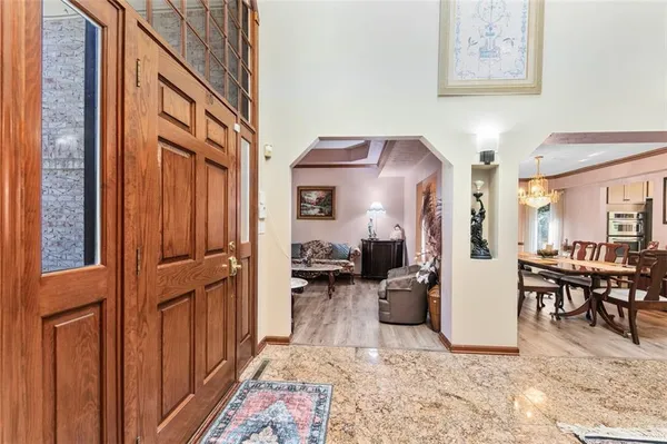 a view of living room filled with furniture and furniture