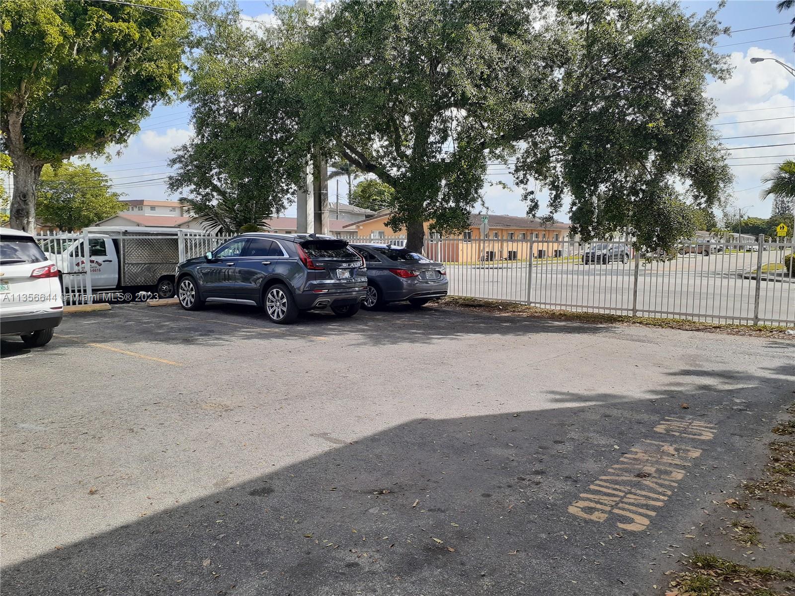 1245 West 24th Street, Unit 118 Hialeah, FL 33010 - Photo 15 of 20 a view of a cars parked in a parking area