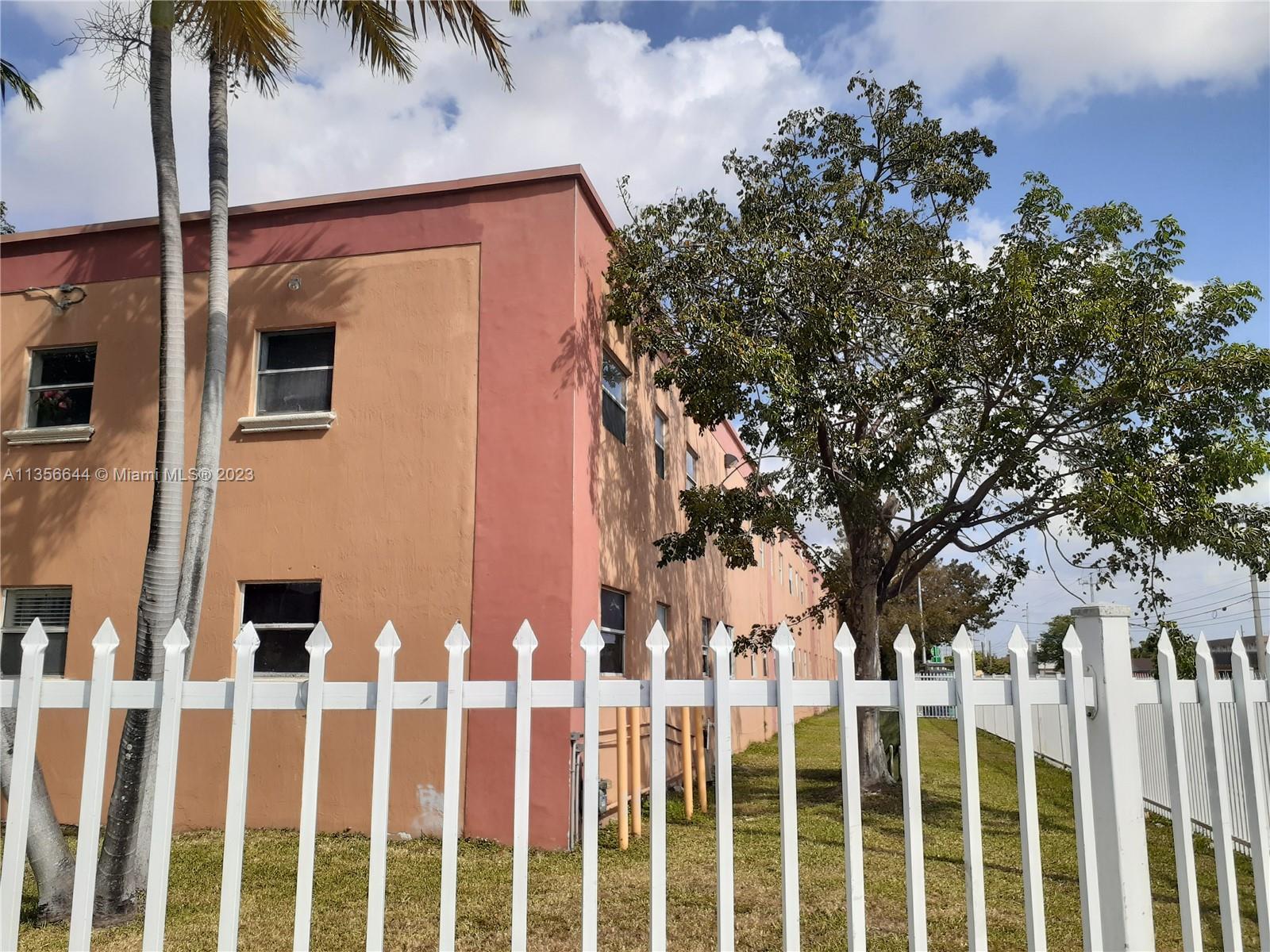 1245 West 24th Street, Unit 118 Hialeah, FL 33010 - Photo 16 of 20 a front view of house with yard