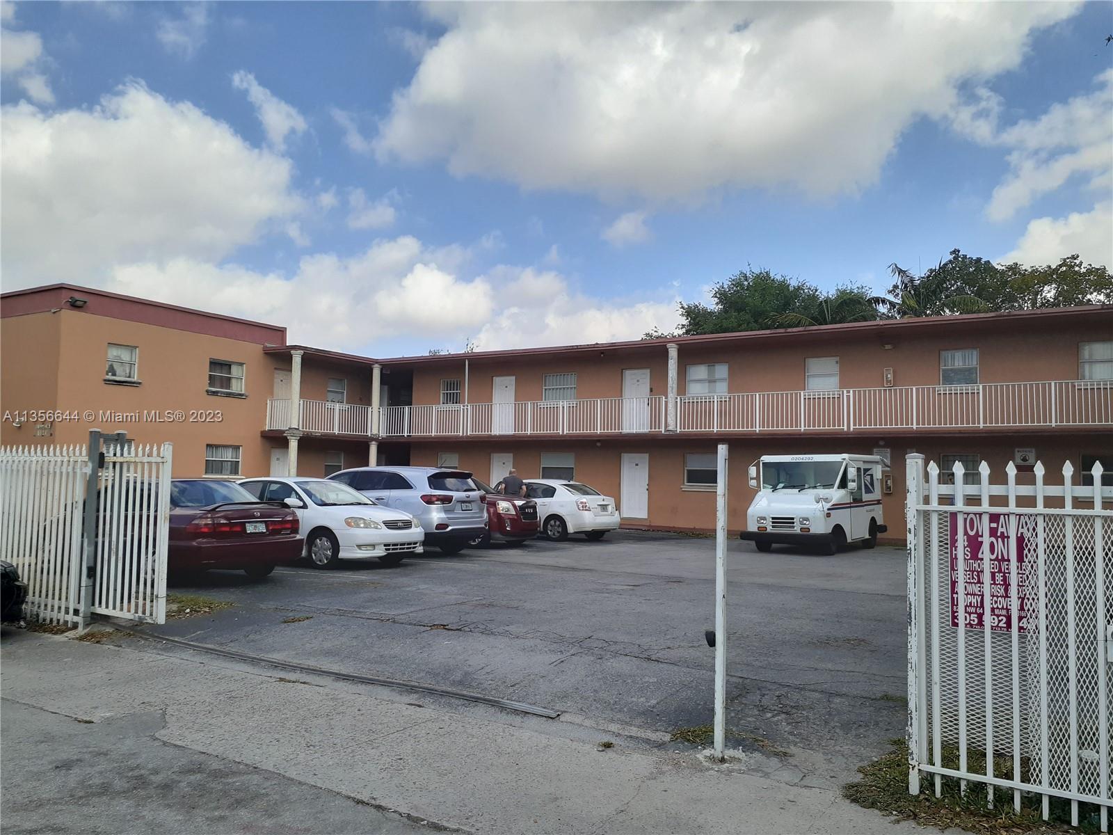 1245 West 24th Street, Unit 118 Hialeah, FL 33010 - Photo 18 of 20 a view of street with parked cars