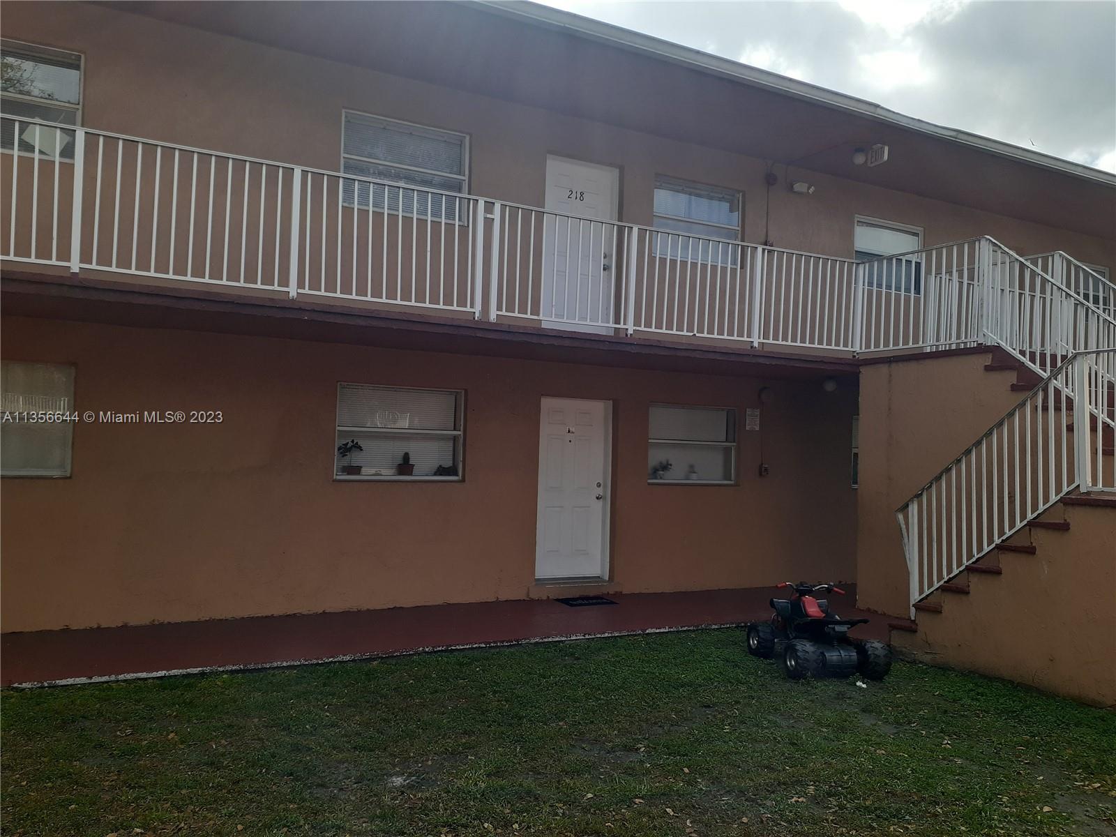 1245 West 24th Street, Unit 118 Hialeah, FL 33010 - Photo 2 of 20 a view of backyard with deck