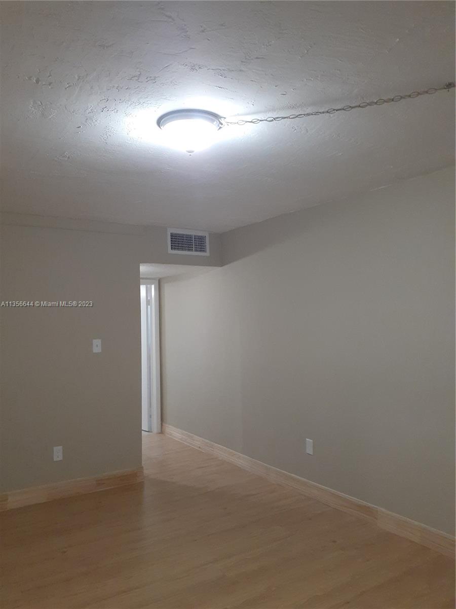 1245 West 24th Street, Unit 118 Hialeah, FL 33010 - Photo 5 of 20 a view of empty room