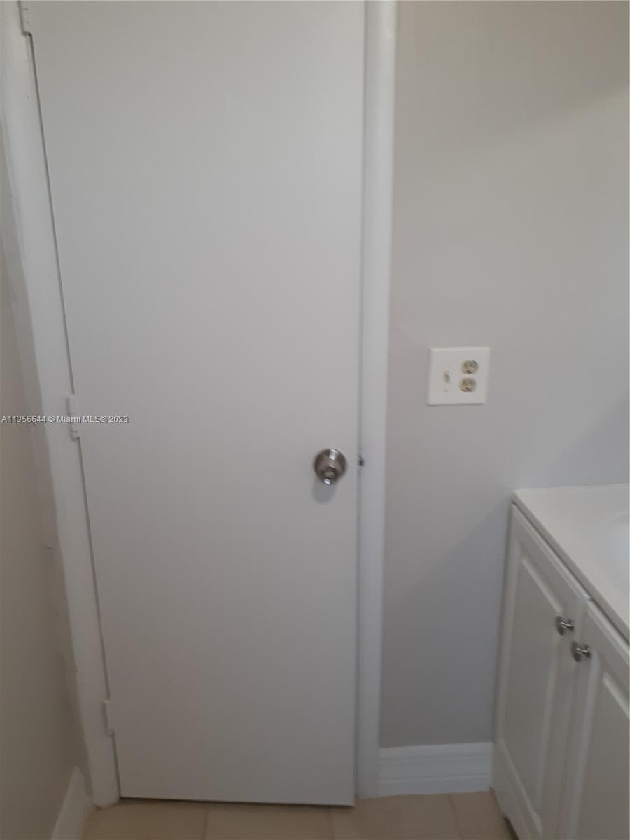 1245 West 24th Street, Unit 118 Hialeah, FL 33010 - Photo 8 of 20 a view of a hallway