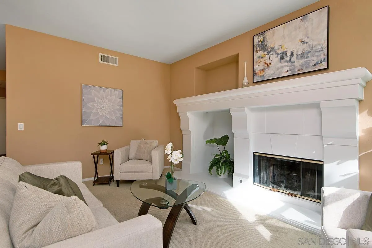 4951 Riding Ridge Road San Diego, CA 92130 - Photo 11 of 32 a living room with furniture and a fireplace