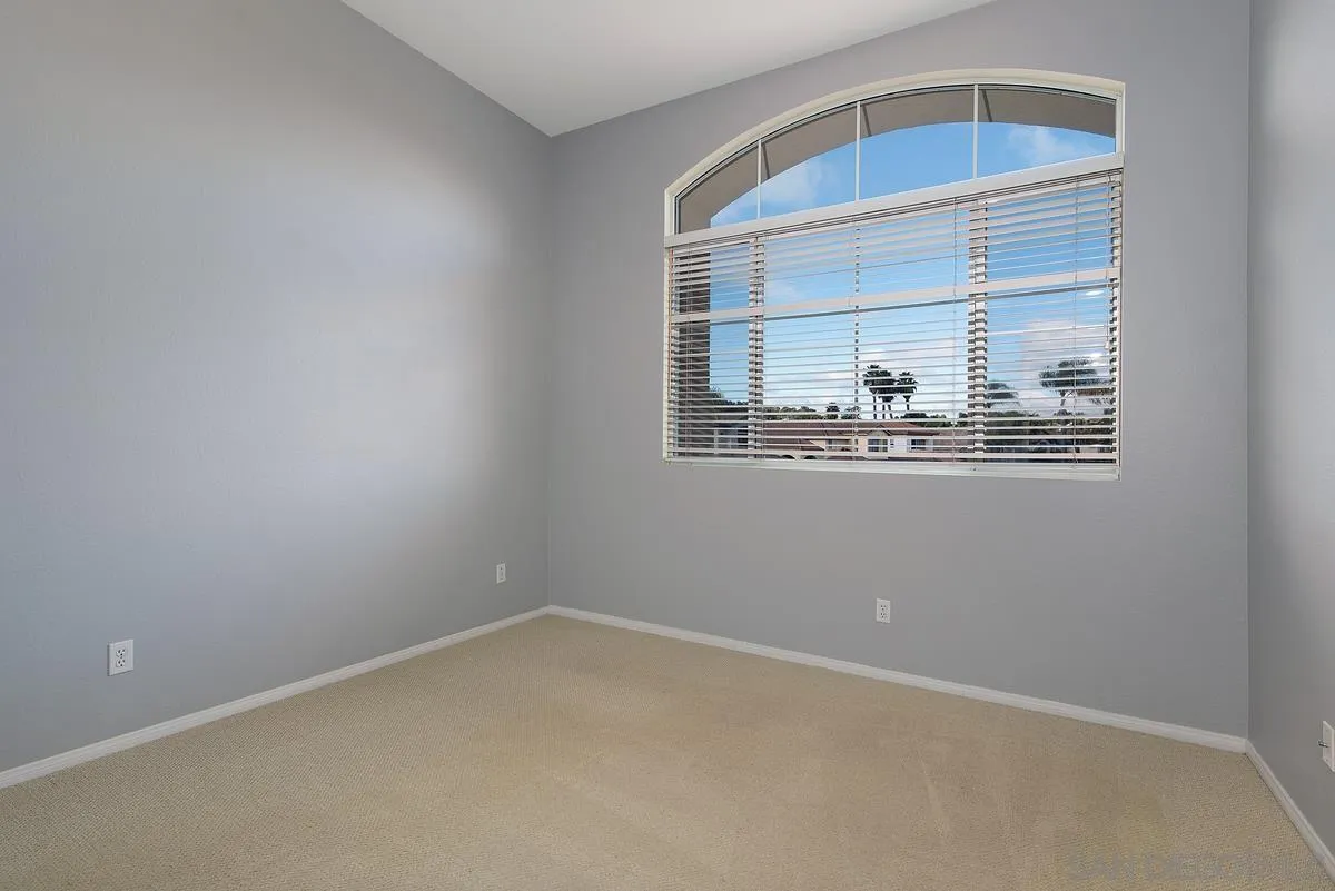 4951 Riding Ridge Road San Diego, CA 92130 - Photo 26 of 32 an empty room with a window