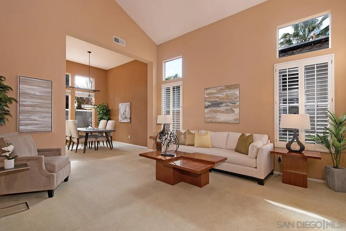 4951 Riding Ridge Road San Diego, CA 92130 - Photo 4 of 32 a living room with furniture and a large window
