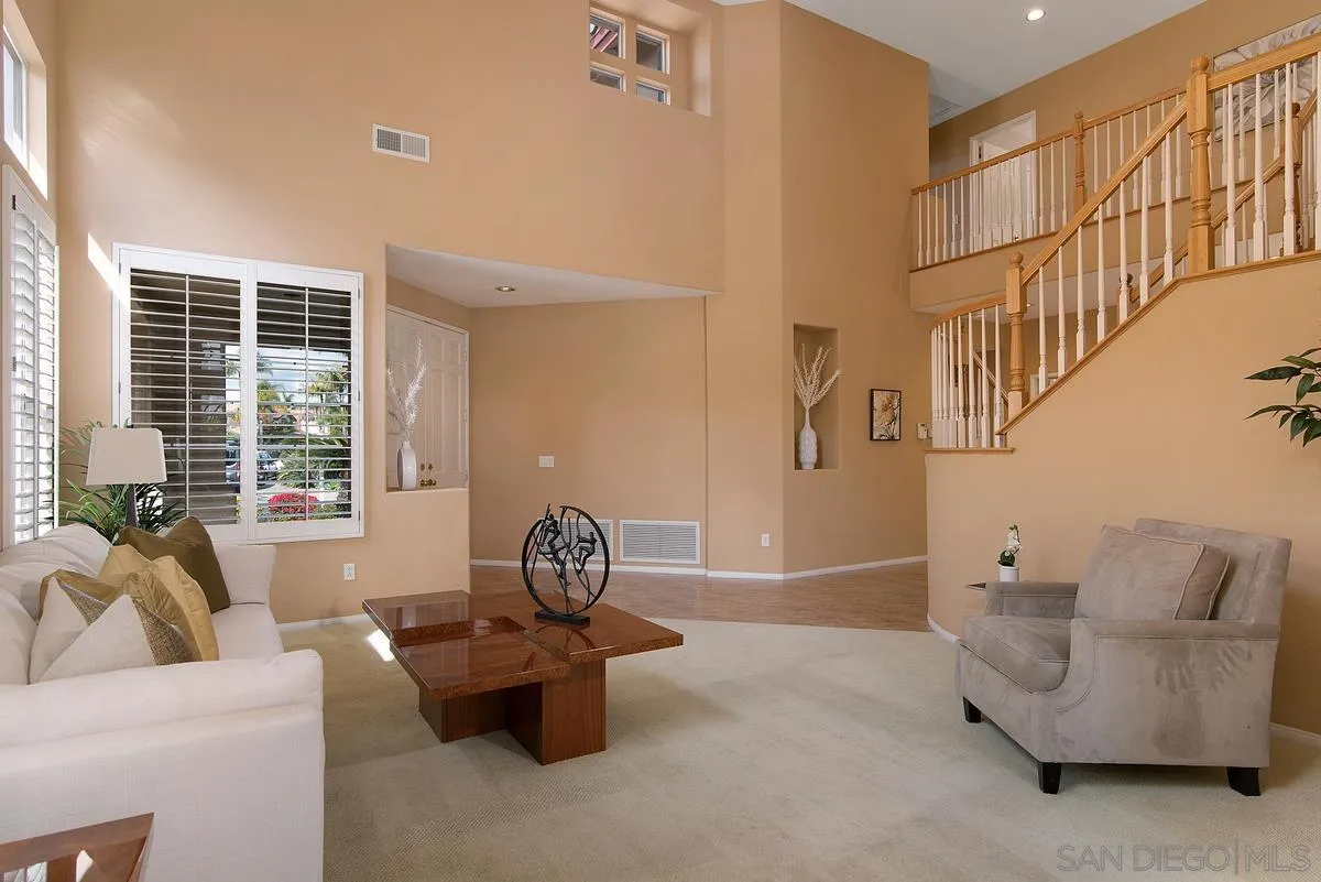 4951 Riding Ridge Road San Diego, CA 92130 - Photo 5 of 32 a living room with furniture and a potted plant